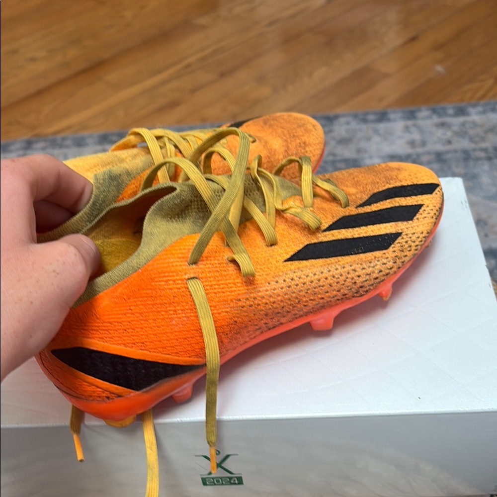 Orange and Black Soccer Cleats